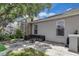 Relaxing backyard area with a patio, comfortable outdoor seating, and privacy screen for peaceful enjoyment at 10293 Cypress Knee Cir, Orlando, FL 32825