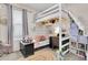 Charming bedroom featuring a loft bed, desk area, and playful decor for a cozy atmosphere at 10293 Cypress Knee Cir, Orlando, FL 32825