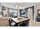 Eat-in dining area adjacent to living room featuring recessed lighting and a sliding glass door to outside at 10293 Cypress Knee Cir, Orlando, FL 32825