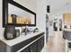 Hallway featuring a hall table with decor and a decorative mirror at 10293 Cypress Knee Cir, Orlando, FL 32825