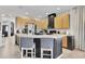 Kitchen with a large island, seating and stainless steel appliances at 10293 Cypress Knee Cir, Orlando, FL 32825