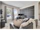 Comfortable living room with large windows, a modern decor, and cozy seating at 10293 Cypress Knee Cir, Orlando, FL 32825