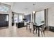 Spacious living area with an open floor plan, tile floors, and a seamless flow to the dining area at 10293 Cypress Knee Cir, Orlando, FL 32825