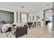 Open living space with tile flooring, dining area, and a view into the kitchen at 10293 Cypress Knee Cir, Orlando, FL 32825