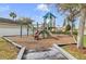Community playground with climbing structure, slide, and play area for Gathering fun at 10293 Cypress Knee Cir, Orlando, FL 32825