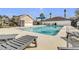 Inviting community pool with lounge chairs, tables, and pristine water for residents to enjoy at 10293 Cypress Knee Cir, Orlando, FL 32825