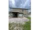 Large covered patio with a brick-paved backyard, great for outdoor entertaining at 10337 Cypress Trail Dr, Orlando, FL 32825