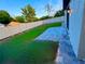 Backyard with a neatly manicured lawn, paved patio, and a modern fence at 107 Grove St, Orlando, FL 32835
