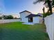 Spacious backyard with a well-maintained lawn and a modern home exterior at 107 Grove St, Orlando, FL 32835