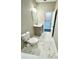 Clean bathroom featuring marble tile flooring, stylish vanity, and modern fixtures at 107 Grove St, Orlando, FL 32835