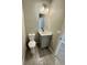 Bathroom featuring a gray vanity with a white countertop, a modern faucet, and a well-lit mirror at 107 Grove St, Orlando, FL 32835