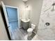 Updated bathroom featuring stylish tile in shower, wood-look flooring, and modern vanity at 107 Grove St, Orlando, FL 32835