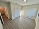 Bedroom showcasing modern flooring, closet, and neutral paint, ready for personalization at 107 Grove St, Orlando, FL 32835