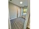 Bedroom with bright natural light, complemented by vinyl plank flooring and neutral paint color at 107 Grove St, Orlando, FL 32835