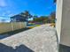 Paver driveway leads to a charming home with a well-maintained exterior and landscaping at 107 Grove St, Orlando, FL 32835