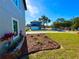 Inviting front yard with a well-manicured garden and a view of the charming home at 107 Grove St, Orlando, FL 32835