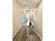 Bright hallway with wood-look floors and a staircase leading to the upper level at 107 Grove St, Orlando, FL 32835