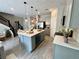Bright, open kitchen features an island, modern appliances, and stylish pendant lighting at 107 Grove St, Orlando, FL 32835