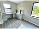 Modern loft space bathed in natural light, featuring stylish grey cabinets, a sink, and chic decor at 107 Grove St, Orlando, FL 32835