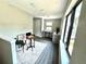 Loft space with integrated desk, bright vinyl floors, ample windows, and modern decor at 107 Grove St, Orlando, FL 32835