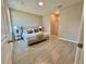 Bright main bedroom with neutral decor and tile floors at 107 Grove St, Orlando, FL 32835