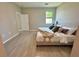 Bright main bedroom with neutral decor and tile floors at 107 Grove St, Orlando, FL 32835