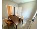 A cozy home office with a wood desk, neutral walls, and light-colored wood-look floors at 107 Grove St, Orlando, FL 32835