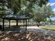 Pavilion in park with seating and shade, ideal for picnics and gatherings at 107 Grove St, Orlando, FL 32835