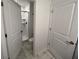 View into a bright bathroom with tile floors and glass shower at 1078 Splash Shot Pl, Davenport, FL 33896