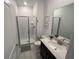 Bathroom featuring modern shower, toilet, vanity, mirror, and decor at 1078 Splash Shot Pl, Davenport, FL 33896