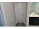 Bright bathroom with dual sink vanity and a restricted area closet at 1078 Splash Shot Pl, Davenport, FL 33896