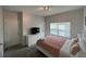 Cozy bedroom featuring a comfortable bed and ample natural light at 1078 Splash Shot Pl, Davenport, FL 33896