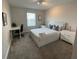 Bedroom showcasing white furniture and a dedicated workspace at 1078 Splash Shot Pl, Davenport, FL 33896
