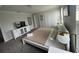 Inviting bedroom features a white frame bed, TV atop a white dresser, and white wardrobe at 1078 Splash Shot Pl, Davenport, FL 33896