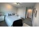 Bedroom showcasing gray carpet, white bedding, and a wardrobe at 1078 Splash Shot Pl, Davenport, FL 33896