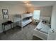 Bright bedroom featuring a bunk bed, twin bed, and Disney decor at 1078 Splash Shot Pl, Davenport, FL 33896