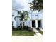 Stylish townhome with a modern exterior, landscaped front yard, and a covered entryway at 1078 Splash Shot Pl, Davenport, FL 33896