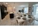 Open-concept living space with modern kitchen, dining area, and comfortable seating at 1078 Splash Shot Pl, Davenport, FL 33896