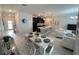 Spacious open floor plan with a dining area, kitchen island, and comfortable living space at 1078 Splash Shot Pl, Davenport, FL 33896