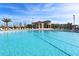 Large, inviting pool with ample lounge chairs for relaxing by the water at 1078 Splash Shot Pl, Davenport, FL 33896