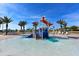 Gathering-friendly splash pad with playful water features and shady umbrellas at 1078 Splash Shot Pl, Davenport, FL 33896