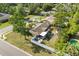 Aerial view of a charming home with a backyard, lush landscaping, and a pool at 110 S Edgemon Ave, Winter Springs, FL 32708