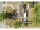 An aerial view of a well-maintained property featuring a spacious backyard and inviting outdoor patio area at 110 S Edgemon Ave, Winter Springs, FL 32708