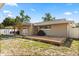 Backyard view featuring a wooden deck and an outdoor covered dining area at 110 S Edgemon Ave, Winter Springs, FL 32708