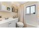 Compact bathroom with a shower-tub combo and decorated with Parisian themed artwork at 110 S Edgemon Ave, Winter Springs, FL 32708
