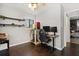 Cozy bedroom with a wood floor, a ceiling fan, and a desk for two computer monitors at 110 S Edgemon Ave, Winter Springs, FL 32708