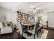 Spacious dining room with elegant decor, featuring built-in bookshelves and a comfortable seating area at 110 S Edgemon Ave, Winter Springs, FL 32708