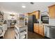 Spacious kitchen featuring stainless steel appliances, light countertops, and dark wood flooring at 110 S Edgemon Ave, Winter Springs, FL 32708