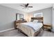 Bedroom featuring wood-look flooring, a ceiling fan, and wood-trimmed furnishings at 117 Georgetown Dr # C, Casselberry, FL 32707