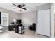 Bedroom with a desk with monitors, in-room closet, wood-look flooring and ceiling fan at 117 Georgetown Dr # C, Casselberry, FL 32707